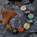 Amulette Bouddhiste représentant les 7 Chakras