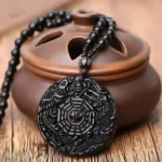 Amulette Ying Yang en noir, symbole d'équilibre spirituel