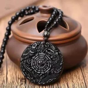 Amulette Ying Yang en noir, symbole d'équilibre spirituel