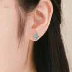 Boucles d'oreilles en argent symbolisant la protection Hamsa