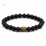 Bijou zen avec tête de Bouddha et motif sacré Om