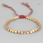 Bracelet doré au design bouddhiste, accessoire de bien-être