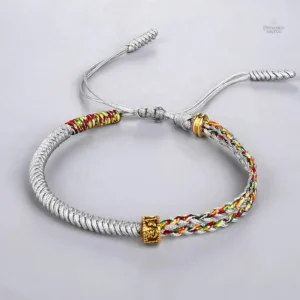 Accessoire spirituel noir et jaune en tressage