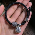 Bracelet Tibétain Noir avec breloques en cuivre