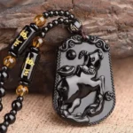 Bijou méditatif : collier en obsidienne Bouddha