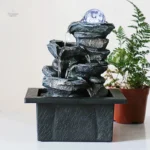 Fontaine zen avec jeux d'eau apaisants en intérieur