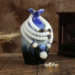 Mala traditionnel avec pierres blanches décoratives