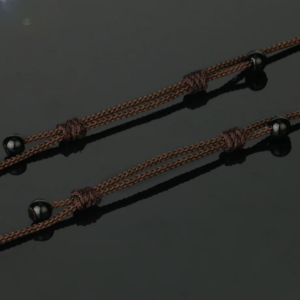 Collier Bouddha avec pendentif sculpté en Oeil de Tigre