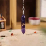 Accessoire de divination : pendule en pierre naturelle OM