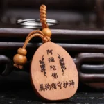 Porte clé porte bonheur, design Bouddha souriant en métal