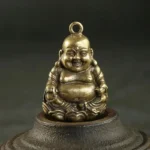 Porte-clés représentant Bouddha joyeux