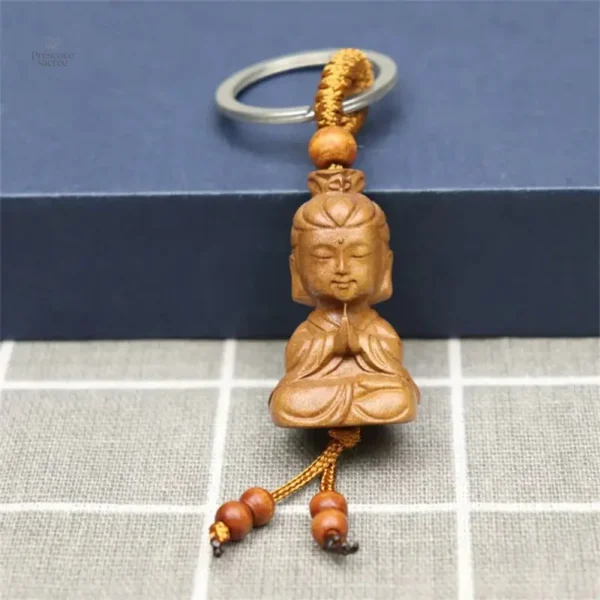 Porte-clés en bois avec petit Bouddha sculpté