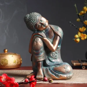 Statuette Bouddha en position de sommeil, zen et reposante