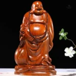 Bouddha en bois massif, sourire bienveillant