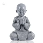 Moine méditant en statuette, inspiration pour la méditation